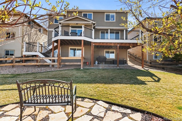 11991 Hazy Hills Dr, Parker, CO 80138 - rear view of property featuring a patio area, stairway, a yard, and a wooden deck