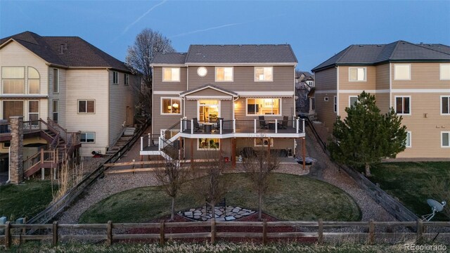 11991 Hazy Hills Dr, Parker, CO 80138 - rear view of house with a patio area, a fenced backyard, a deck, and stairs