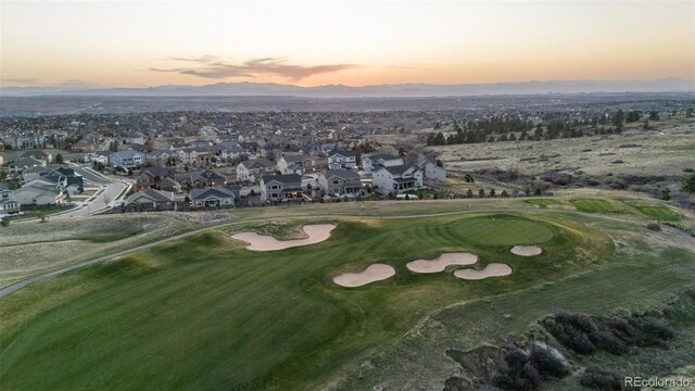 11991 Hazy Hills Dr, Parker, CO 80138 - aerial view at dusk featuring golf course view, a residential view, and a mountain view
