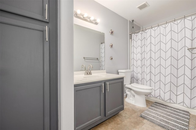 full bathroom featuring vanity, toilet, a shower with shower curtain, and tile patterned flooring