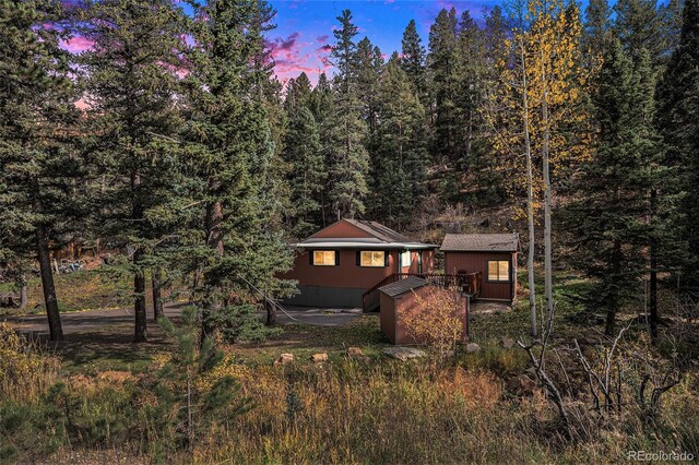 28532 Shadow Mountain Dr, Conifer, CO 80433 - rear view of house featuring a forest view