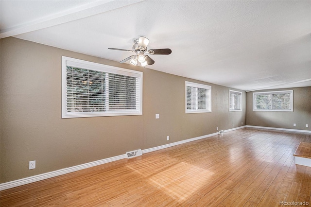 unfurnished room with wood-type flooring and ceiling fan