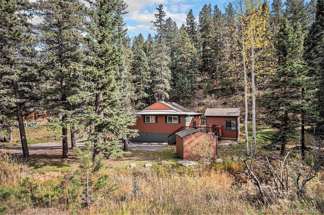 28532 Shadow Mountain Dr, Conifer, CO 80433 - rear view of house featuring a wooded view
