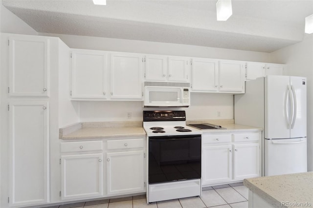 kitchen featuring white appliances, white cabinetry, light tile patterned floors, and light countertops