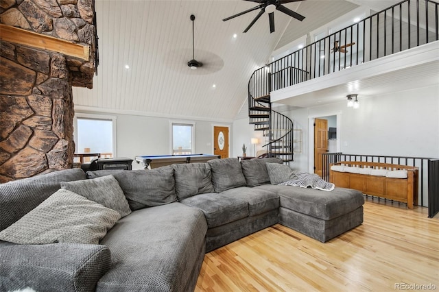 31551 Black Widow Dr, Conifer, CO 80433 - living room with high vaulted ceiling, a ceiling fan, wood finished floors, billiards table, and stairs