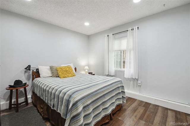 31551 Black Widow Dr, Conifer, CO 80433 - bedroom featuring recessed lighting, wood finished floors, and a textured ceiling