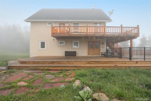 31551 Black Widow Dr, Conifer, CO 80433 - back of property with a deck, french doors, and stucco siding