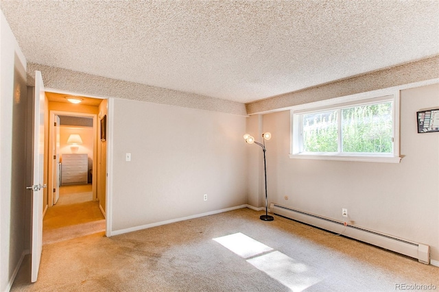 8888 W 37th Pl, Wheat Ridge, CO 80033 - unfurnished bedroom featuring a baseboard heating unit, carpet, and a textured ceiling
