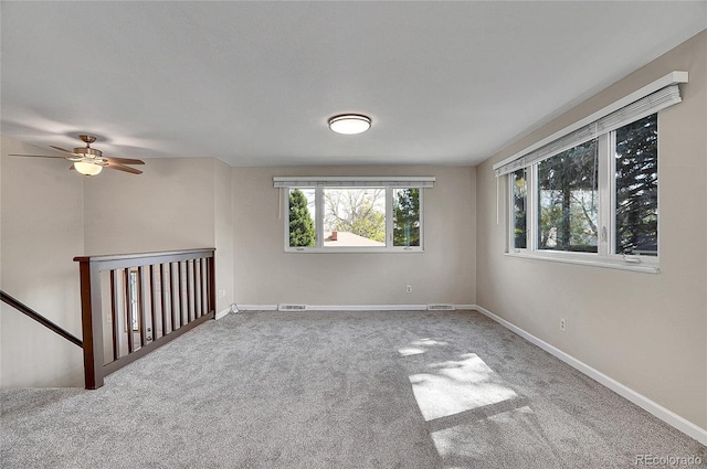 9099 W Harvard Pl, Lakewood, CO 80227 - carpeted spare room featuring baseboards and a ceiling fan