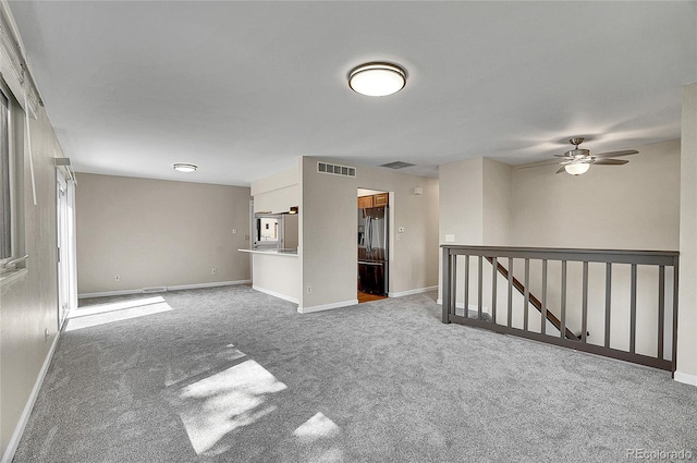 9099 W Harvard Pl, Lakewood, CO 80227 - carpeted spare room with baseboards and a ceiling fan