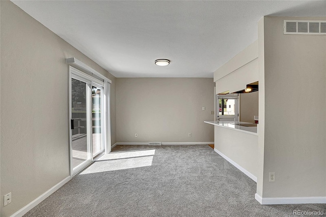 9099 W Harvard Pl, Lakewood, CO 80227 - carpeted spare room featuring baseboards