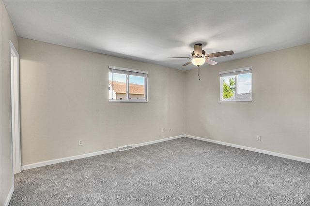 9099 W Harvard Pl, Lakewood, CO 80227 - unfurnished room with healthy amount of natural light, ceiling fan, and baseboards
