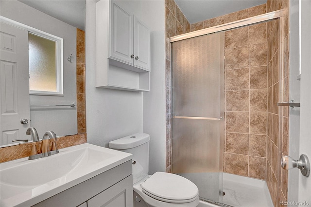 9099 W Harvard Pl, Lakewood, CO 80227 - bathroom with a shower stall, toilet, and vanity