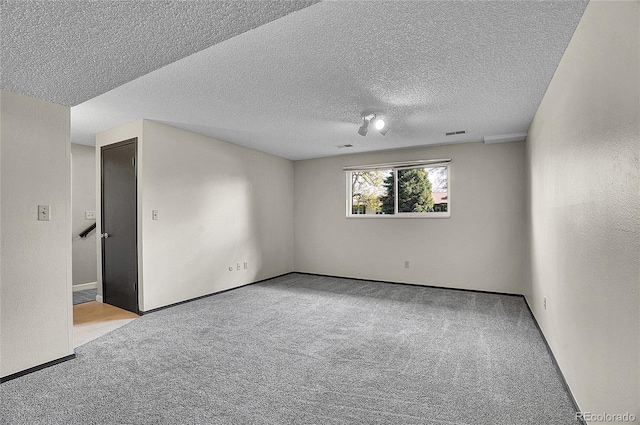 9099 W Harvard Pl, Lakewood, CO 80227 - carpeted spare room with a textured ceiling and baseboards