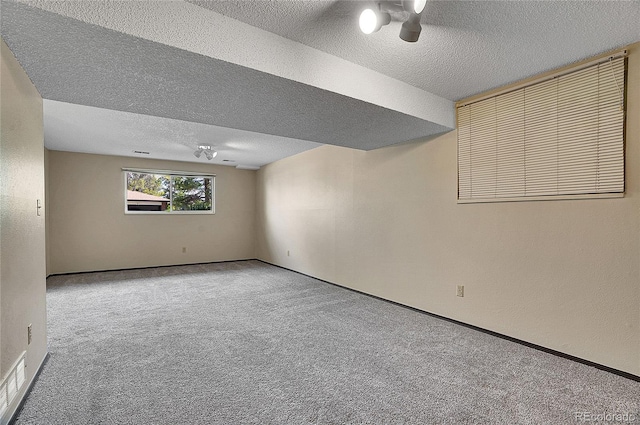 9099 W Harvard Pl, Lakewood, CO 80227 - carpeted spare room featuring a textured ceiling and baseboards