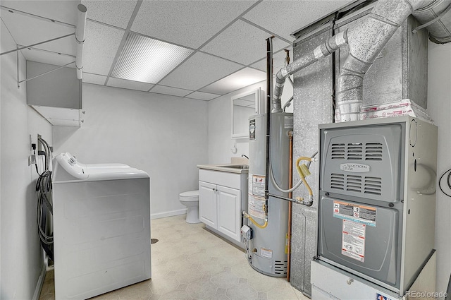 9099 W Harvard Pl, Lakewood, CO 80227 - laundry area featuring water heater, light floors, separate washer and dryer, a sink, and heating unit