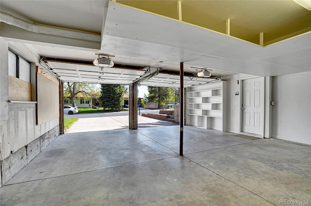 9099 W Harvard Pl, Lakewood, CO 80227 - garage featuring a garage door opener