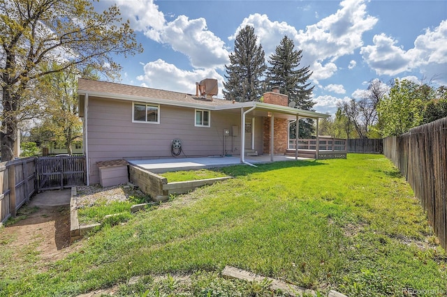 9099 W Harvard Pl, Lakewood, CO 80227 - back of property with a patio and a chimney