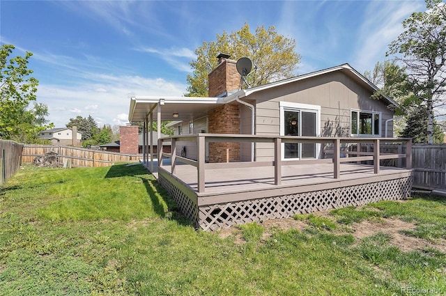 9099 W Harvard Pl, Lakewood, CO 80227 - back of house featuring a chimney and a deck