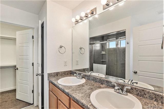 bathroom with vanity and walk in shower