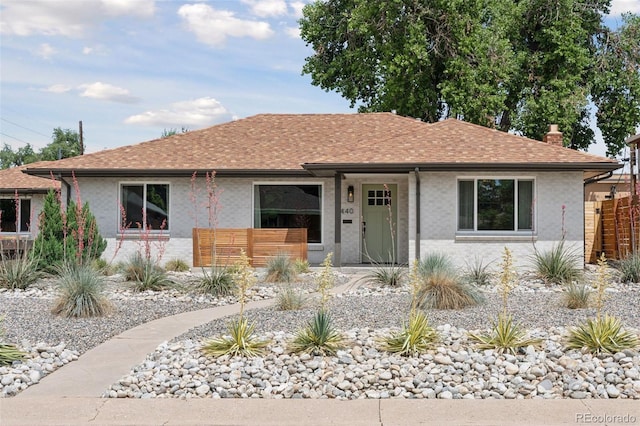 3440 N Harrison St, Denver, CO 80205 - ranch-style home featuring a chimney, a shingled roof, and stucco siding