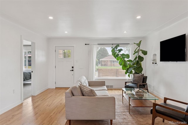3440 N Harrison St, Denver, CO 80205 - living area featuring healthy amount of natural light, recessed lighting, and light wood-style flooring