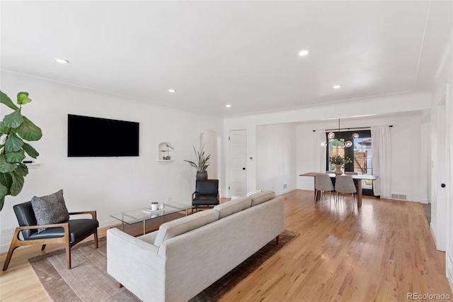 3440 N Harrison St, Denver, CO 80205 - living room with light wood finished floors and recessed lighting