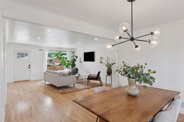 3440 N Harrison St, Denver, CO 80205 - dining room with light wood-type flooring, a chandelier, and recessed lighting