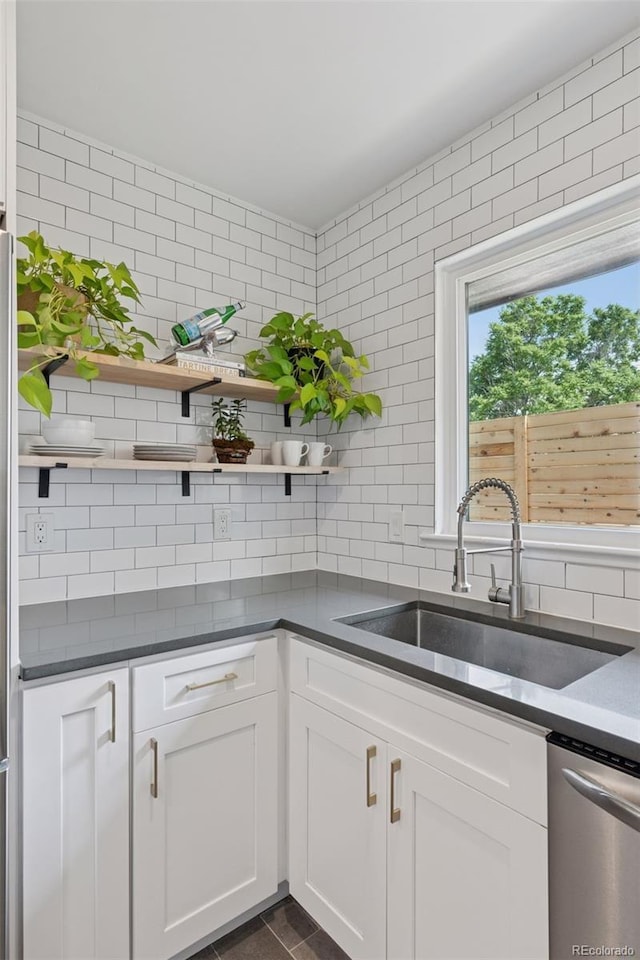 3440 N Harrison St, Denver, CO 80205 - kitchen with dishwasher, open shelves, and tasteful backsplash