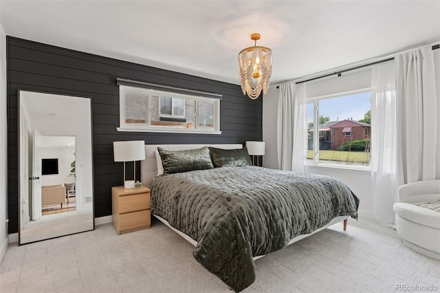 3440 N Harrison St, Denver, CO 80205 - bedroom with a chandelier and wood walls