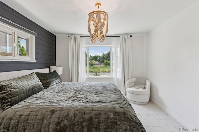 3440 N Harrison St, Denver, CO 80205 - bedroom with a chandelier and wood walls
