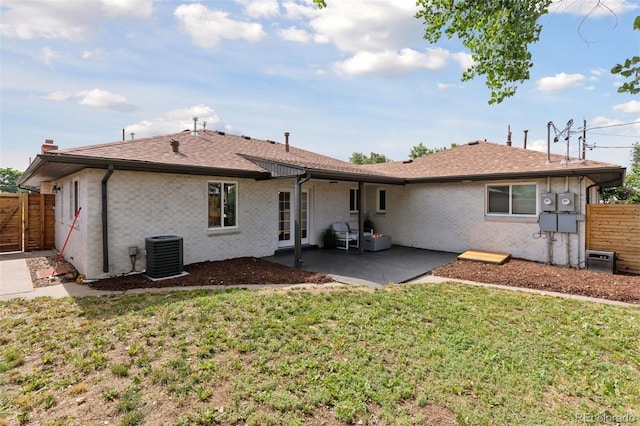 3440 N Harrison St, Denver, CO 80205 - rear view of house featuring a patio, brick siding, and a shingled roof