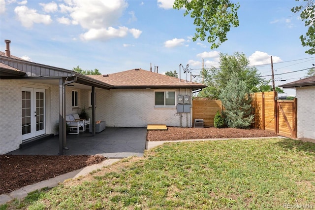 3440 N Harrison St, Denver, CO 80205 - back of property featuring french doors, a patio, brick siding, and a gate