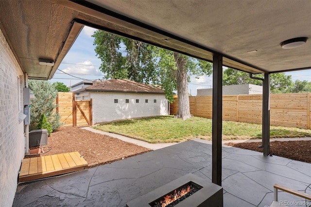 3440 N Harrison St, Denver, CO 80205 - fenced backyard featuring a patio, a fire pit, and a gate