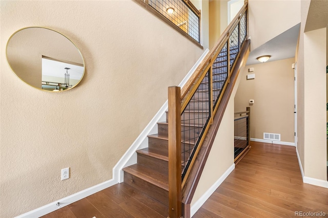 6858 Otis Ct, Arvada, CO 80003 - stairs with hardwood / wood-style flooring and a towering ceiling