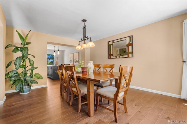 6858 Otis Ct, Arvada, CO 80003 - dining room featuring light wood-type flooring and baseboards