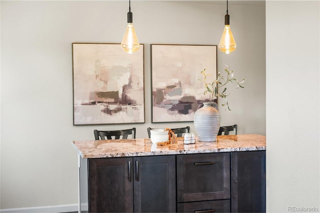 6858 Otis Ct, Arvada, CO 80003 - bar featuring decorative light fixtures