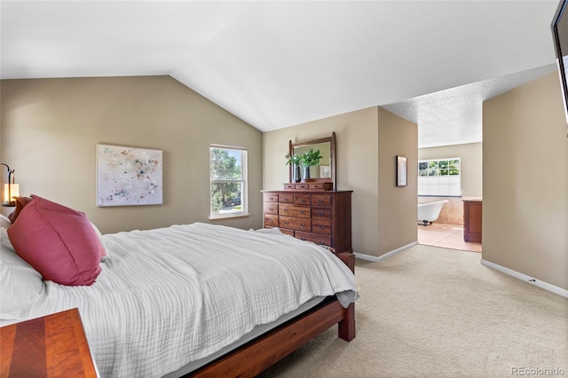 6858 Otis Ct, Arvada, CO 80003 - bedroom with light carpet, lofted ceiling, and connected bathroom