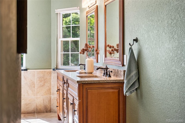 6858 Otis Ct, Arvada, CO 80003 - full bath with double vanity and a textured wall