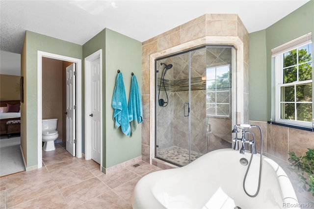 6858 Otis Ct, Arvada, CO 80003 - bathroom with a bathtub, a stall shower, and tile walls