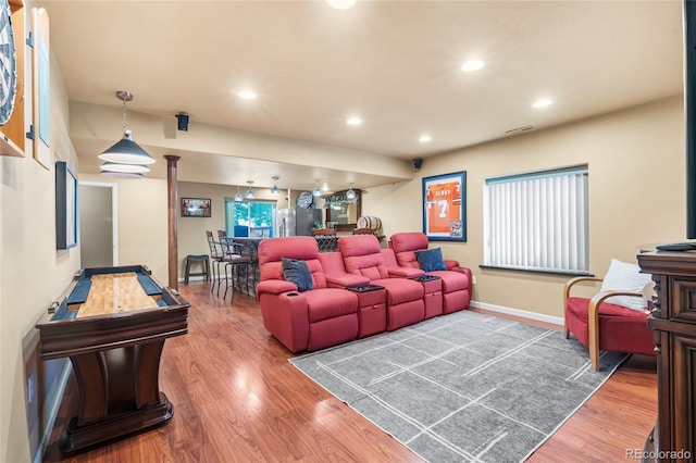 6858 Otis Ct, Arvada, CO 80003 - home theater room with wood finished floors and recessed lighting