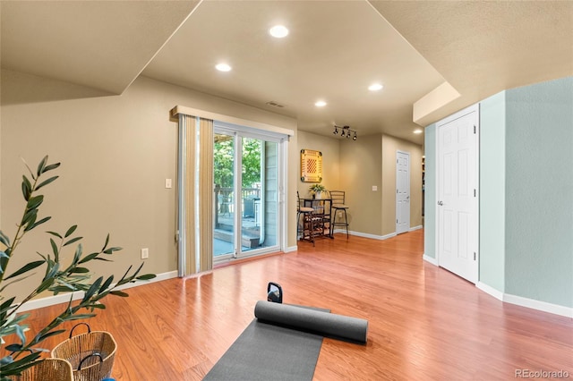 6858 Otis Ct, Arvada, CO 80003 - workout area with wood finished floors and recessed lighting
