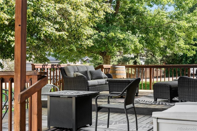 6858 Otis Ct, Arvada, CO 80003 - wooden deck with outdoor lounge area
