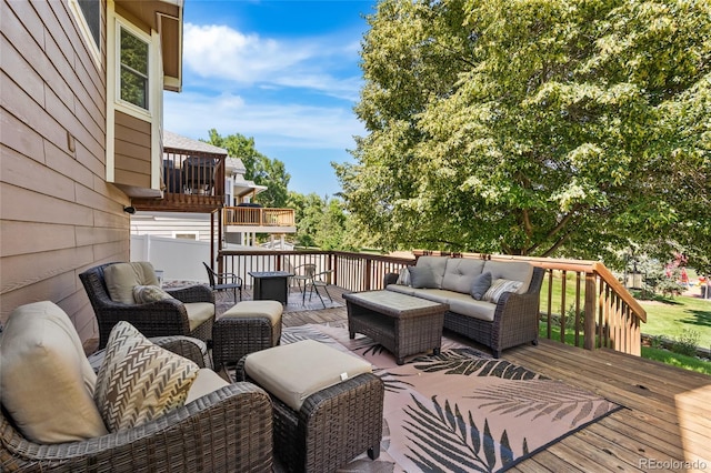 6858 Otis Ct, Arvada, CO 80003 - wooden deck featuring an outdoor living space