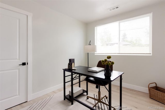 office featuring light wood finished floors and baseboards