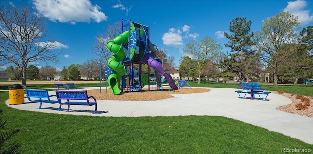 view of jungle gym featuring a lawn