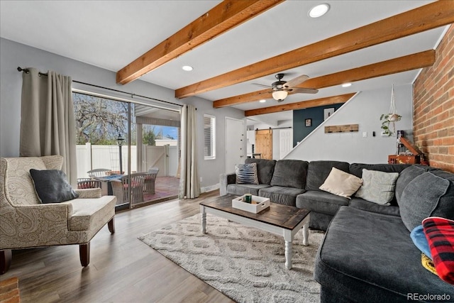 living area with ceiling fan, wood finished floors, beamed ceiling, and recessed lighting