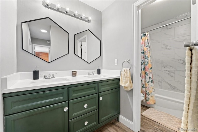 full bathroom with a sink, double vanity, shower / bathtub combination with curtain, and wood finished floors