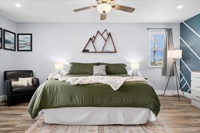 bedroom with wood finished floors, baseboards, a ceiling fan, and recessed lighting