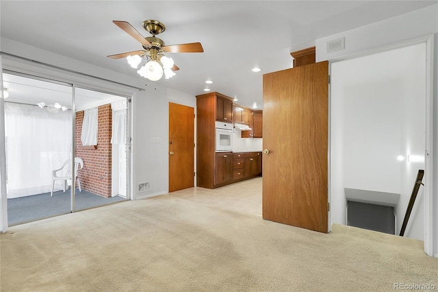 3022 Blackhawk St, Aurora, CO 80011 - unfurnished living room with ceiling fan, recessed lighting, visible vents, and light colored carpet